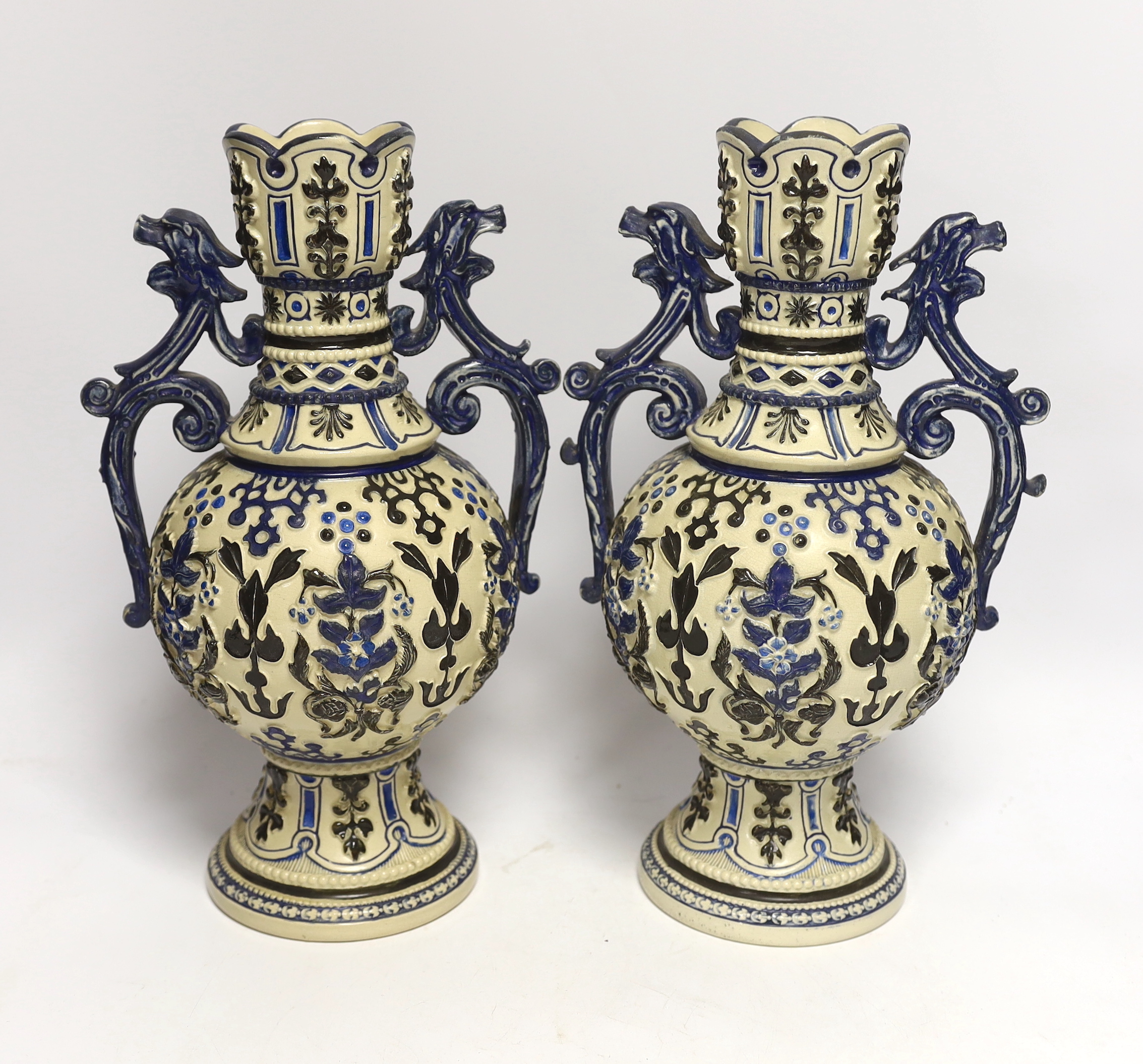 A pair of 20th century German pottery vases, 32cm